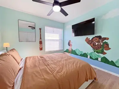 a bedroom with a bed and a ceiling fan at Magical Dreams home in Kissimmee