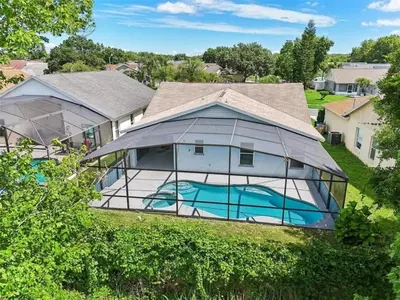 an exterior view of a home with a glass house at Magical Dreams home in Kissimmee