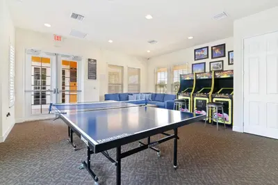 a ping pong room with a ping pong table at Unplug in your private oasis-NEW corner Home Pool in Orlando