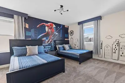 a bedroom with two beds and a boy doing a skateboard trick at Casa 7Q Storey Lake c/ Piscina, Spa e Game Room in Kissimmee