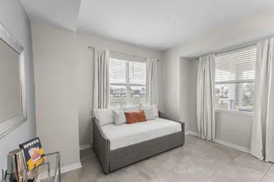 a bedroom with a bed and a large window at 3121-207 Resort Lake View Disney Universal Orlando in Kissimmee