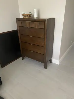 a wooden dresser in the corner of a room at Orlando 4 bedroom built in 2021 in Orlando