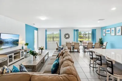 a large living room with a couch and a table at Lake Side View Private Pool Home In Resort! villa in Kissimmee