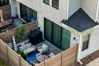 an overhead view of a balcony with chairs and a table at Gated community 4BD townhouse next to Disney in Kissimmee