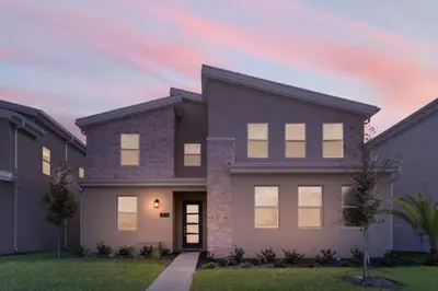 a rendering of a home at dusk at 6 Bedrooms 6 Bathrooms Storey Lake home in Orlando