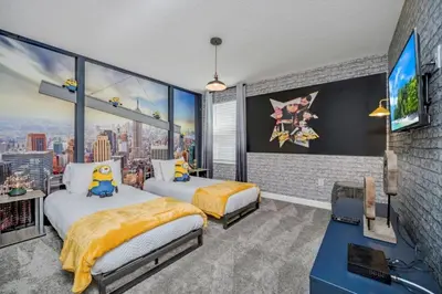 a bedroom with two beds and a large window at 9 bedrooms 5 Bathrooms Storey Lake Game Room Too home in Kissimmee