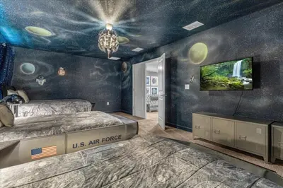 a us air force bedroom with a us air force room at 8 Bedroom & Theme Rooms For Kids In Storey Lake home in Kissimmee