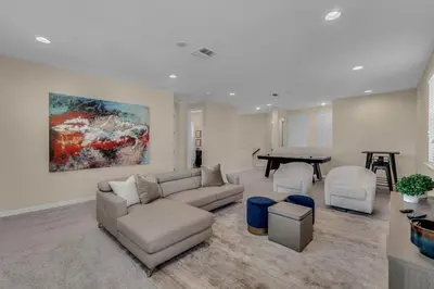 a living room with a couch and a table at 5 Bedrooms 5,5 Bathrooms Solara home in Orlando