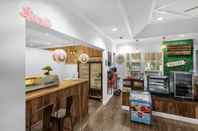 a fast food restaurant with a counter and chairs at 3 Bed 2 Bath Condo in Lucaya Village Near Disney townhouse in Kissimmee