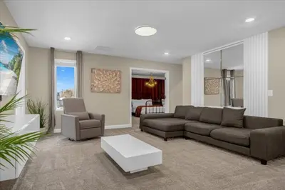 a living room with a couch and a coffee table at 9 bed Home Storey Lake home in Kissimmee