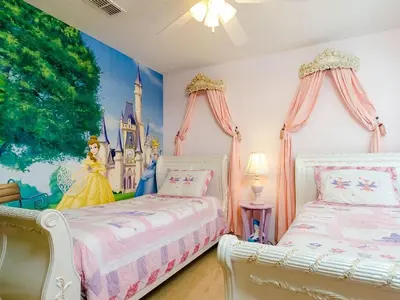 a bedroom with two beds and a disney princess mural at Southern Comfort Private Pool Spa Near Disney! villa in Kissimmee