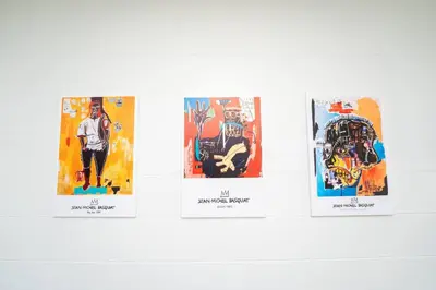 a group of four posters on a wall at Close to the Action, Peaceful When You Return in Orlando