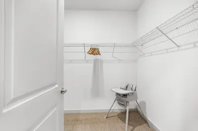 a white room with a sink and a chair at Magical Retreat Outside of Disney in Orlando