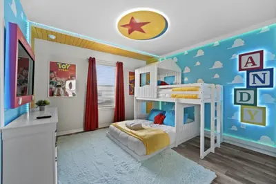 a bedroom with a white bunk bed and a blue wall at New 2025 Bambi Orlando Pool Vacation Home in Clermont