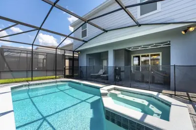 a swimming pool in a house with a glass ceiling at New 2025 Bambi Orlando Pool Vacation Home in Clermont