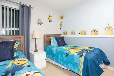a childs bedroom with two beds andanimal heads on the wall at Family Friendly 4 Bedrooms with GameRoom close to Disney in Compass Bay 5103 in Kissimmee