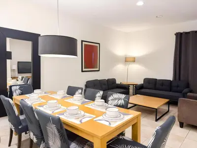 a living room with a table and chairs at ER3047WOR - Cozy 3BD Townhome w/ Private Hot Tub in Kissimmee