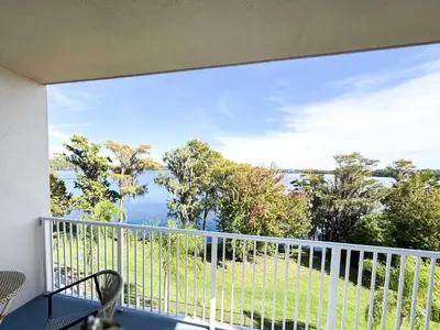 a balcony with a view of the water at BHBR207 - Condo Close to Disney - 1 mile in Orlando
