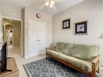 a living room with a couch and a tv at Coral Cay Resort Your home away from home! in Kissimmee