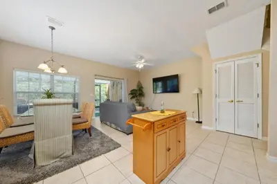 a living room with a couch and a table at Coral Cay Resort Your home away from home! in Kissimmee