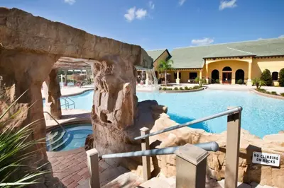 a resort with a swimming pool and a building at Florida Dreaming home in Kissimmee
