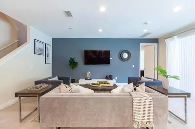 a living room with a couch and a table at Incredible 8BR PetFriendly Encore Resort next to Disney - 7474 in Orlando