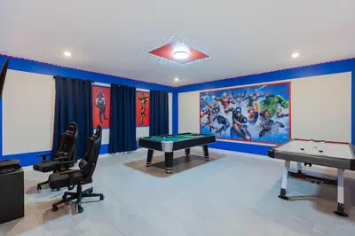 a gaming room with a pool table and a mural at Gorgeous 6BR at Storey Lake next to Disney - 2850 in Kissimmee