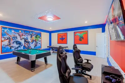 a gaming room with a pool table and gaming chairs at Gorgeous 6BR at Storey Lake next to Disney - 2850 in Kissimmee