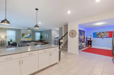 a large kitchen with a living room and a dining room at Gorgeous 6BR at Storey Lake next to Disney - 2850 in Kissimmee