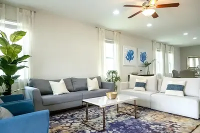 a living room with a couch and a table at Gorgeous 8BR PetFriendly at Encore Resort next to Disney - 7625 in Orlando
