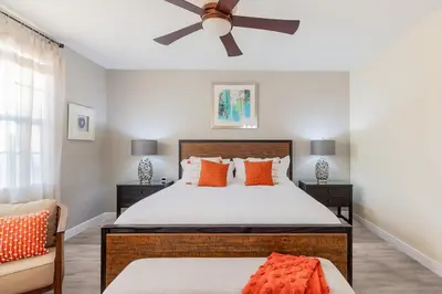 a bedroom with a bed and a ceiling fan at Gorgeous 8BR PetFriendly at Encore Resort next to Disney - 7625 in Orlando