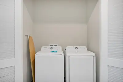 two white refrigerators sitting next to each other in a room at The Lime Life Cottage Near Disney With Margaritaville Resort And Island H20 Waterpark Access - 8056Sh in Orlando