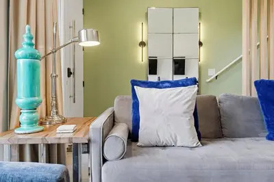 a living room with a couch and a table at The Hub Beautiful Townhome Near Parks in Kissimmee