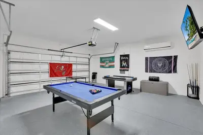 a room with a ping pong table in it at Charming 4 Bdr Villa near Disney in Kissimmee