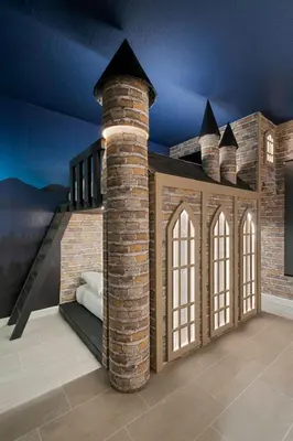 a room with a castle themed room with a brick fireplace at Orlando Paradise 5BR Themed Home in Orlando