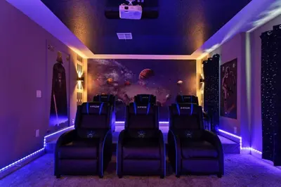 a room with chairs in a room with purple lights at Casa 9Q em Resort c/ Piscina – 11km da Disney in Kissimmee