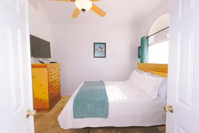 a bedroom with a bed and a ceiling fan at Spacious Home Perfect for Big Families in Kissimmee