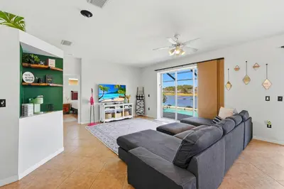 a living room with a couch and a tv at 2989 - Flamingo Farmhouse in Kissimmee