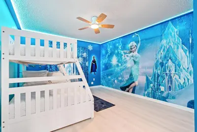 a childs room with a disneyrozen wall mural at Comfortable 6-Bedroom Getaway Near Top Attractions in Kissimmee