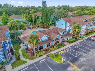 an aerial view of a villa with a parking lot at Resort Stay Near Disney Bright Gym Hot Tub in Kissimmee
