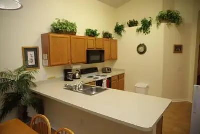 a kitchen with a sink and a counter top at Lake Berkley 5 bedroom 3 bath villa near Disneyland in Kissimmee