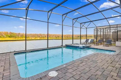 an indoor swimming pool with a large glass house at 4177 Paragraph Drive in Kissimmee