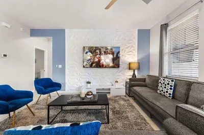 a living room with a couch and a table at 4449 Shiva Loop in Kissimmee
