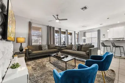 a living room with a couch and a table at 4449 Shiva Loop in Kissimmee