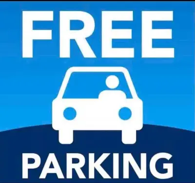 a sign that says free parking with a car on it at Condo Free Parking near Disney Universal in Orlando
