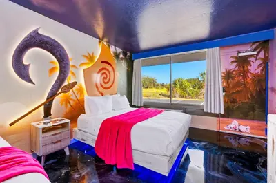 a bedroom with a fish tank painted on the wall at Moana Adventure Suite Near Disney in Kissimmee