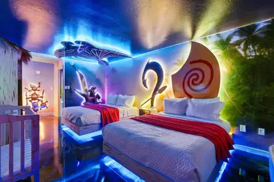 a room with two beds in a room with lights at Moana Adventure Suite Near Disney in Kissimmee