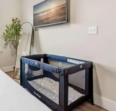 a dog bed in the corner of a room at Riviere 3BR Apartment Stylish King Family Pets Friendly Pool & Gym Near Epic Universe in Orlando