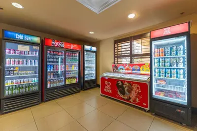 a store with two refrigerators in a grocery store at Cozy 1BR near Universal International Drive in Orlando