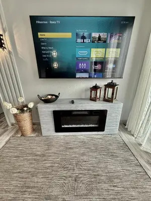 a living room with a flat screen tv on a wall at Entire condo near Universal Studios in Orlando - Free Resort Access in Orlando